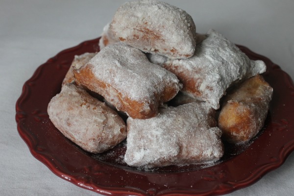powdered beignets on a plate